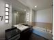 Modern bathroom features a dual-sink vanity, soaking tub, and walk-in shower at 900 Las Vegas Blvd # 1003, Las Vegas, NV 89101