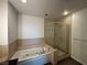 Elegant bathroom with a soaking tub and glass-enclosed shower at 900 Las Vegas Blvd # 1003, Las Vegas, NV 89101