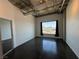 Bedroom boasts concrete ceilings, natural light, and a stunning city view at 900 Las Vegas Blvd # 1003, Las Vegas, NV 89101