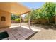 Covered patio with tile flooring and privacy wall, perfect for outdoor dining or entertaining at 9025 Rusty Rifle Ave, Las Vegas, NV 89143