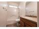 Bathroom features tub/shower combo and wooden vanity with marble countertop at 9025 Rusty Rifle Ave, Las Vegas, NV 89143