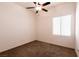 Bedroom with a window, ceiling fan and neutral carpeting at 9025 Rusty Rifle Ave, Las Vegas, NV 89143