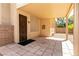 Charming covered patio with decorative door, offering a relaxing outdoor space at 9025 Rusty Rifle Ave, Las Vegas, NV 89143