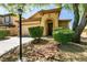 Inviting home exterior showcasing a well-kept lawn, attractive landscaping, and a welcoming entrance at 9025 Rusty Rifle Ave, Las Vegas, NV 89143