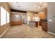 Bright living space with tiled floors open to kitchen and dining areas, lots of natural light at 9025 Rusty Rifle Ave, Las Vegas, NV 89143