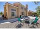Backyard featuring a covered patio and a gravel area with a fire pit and patio seating at 9428 Sierra Summit Ave, Las Vegas, NV 89134