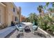 Backyard featuring a covered patio and a gravel area with a fire pit and patio seating at 9428 Sierra Summit Ave, Las Vegas, NV 89134