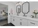 Bright bathroom featuring a double sink vanity and access to the primary bedroom at 9428 Sierra Summit Ave, Las Vegas, NV 89134