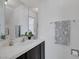 Clean bathroom featuring vanity with granite countertops, decorative mirror and tile backsplash at 9428 Sierra Summit Ave, Las Vegas, NV 89134