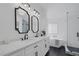 Elegant bathroom featuring double sinks, modern fixtures, tub, and glass shower at 9428 Sierra Summit Ave, Las Vegas, NV 89134