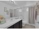 Bright bathroom with updated fixtures, framed art, and modern neutral decor at 9428 Sierra Summit Ave, Las Vegas, NV 89134