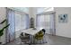 Inviting dining space with patterned curtains, marble table, stylish chairs, and bright natural light at 9428 Sierra Summit Ave, Las Vegas, NV 89134