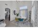 Stylish dining room with marble table, colorful chairs, high ceilings, and bright natural light at 9428 Sierra Summit Ave, Las Vegas, NV 89134
