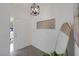 Bright entryway featuring a light-colored door, modern light fixture, and decorative wall art at 9428 Sierra Summit Ave, Las Vegas, NV 89134