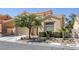 Two-story home with a desert landscape, showcasing its inviting entrance and curb appeal at 9428 Sierra Summit Ave, Las Vegas, NV 89134