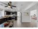 Spacious kitchen with dark cabinetry, stainless steel appliances, granite countertops, and an island at 9428 Sierra Summit Ave, Las Vegas, NV 89134