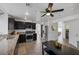 Bright kitchen with stainless steel appliances, dark cabinetry, granite countertops, and stylish design at 9428 Sierra Summit Ave, Las Vegas, NV 89134