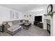Bright living room featuring a fireplace, large TV, and sectional sofa at 9428 Sierra Summit Ave, Las Vegas, NV 89134
