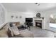 Cozy living room with a comfortable sectional sofa, fireplace, and access to the outdoors at 9428 Sierra Summit Ave, Las Vegas, NV 89134