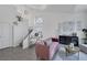 Bright living room featuring a staircase, modern furniture, and stylish decor at 9428 Sierra Summit Ave, Las Vegas, NV 89134