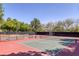Exterior view of well-maintained community tennis courts with green and red surfaces at 9428 Sierra Summit Ave, Las Vegas, NV 89134