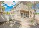 Backyard has fence, some shade trees and brick-paver patio at 9490 Thunder Sky St # 102, Las Vegas, NV 89178
