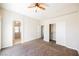 Bright bedroom with carpet, fan, closet and adjacent bathroom at 9490 Thunder Sky St # 102, Las Vegas, NV 89178