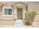 Inviting front entrance with tasteful landscaping and a charming doorway, creating curb appeal at 9490 Thunder Sky St # 102, Las Vegas, NV 89178
