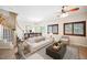Bright living room with modern furnishings and stylish decor, seamlessly flowing to dining area at 9490 Thunder Sky St # 102, Las Vegas, NV 89178