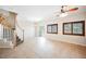 Bright living room with stylish decor, seamlessly flowing to stairs and dining area at 9490 Thunder Sky St # 102, Las Vegas, NV 89178