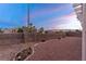 Large backyard features a block wall, rock landscaping, and is awaiting your personal touch at 9785 Turtle Head Ct, Las Vegas, NV 89117