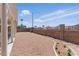 Large backyard features a covered patio and low-maintenance desert landscaping at 9785 Turtle Head Ct, Las Vegas, NV 89117