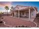 Charming backyard with covered patio, decorative landscaping, and plenty of space for entertaining at 9785 Turtle Head Ct, Las Vegas, NV 89117
