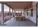 Inviting covered patio featuring a dining set, providing a perfect space for outdoor meals at 9785 Turtle Head Ct, Las Vegas, NV 89117
