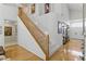 Spacious foyer with wood floors, a grand staircase, and high ceilings for an elegant entrance at 9785 Turtle Head Ct, Las Vegas, NV 89117