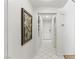 Bright hallway with ceramic tile floors and stylish wall art at 9785 Turtle Head Ct, Las Vegas, NV 89117