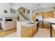 Bright kitchen featuring stainless steel appliances, hardwood floors, a breakfast bar, and a functional layout at 9785 Turtle Head Ct, Las Vegas, NV 89117