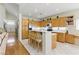 Inviting kitchen area with wood cabinets, stainless steel appliances, and a charming breakfast bar at 9785 Turtle Head Ct, Las Vegas, NV 89117