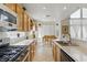 Modern kitchen featuring white countertops, stainless steel appliances, and a breakfast nook at 9785 Turtle Head Ct, Las Vegas, NV 89117
