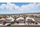 Aerial view of a well-maintained neighborhood with mountain views at 9785 Turtle Head Ct, Las Vegas, NV 89117