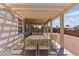 Spacious covered patio with ornate metal table and chairs at 9785 Turtle Head Ct, Las Vegas, NV 89117
