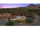 Picturesque aerial view of an estate featuring a unique design, lush landscaping, and scenic surroundings at 1 Costa Del Sol Ct, Henderson, NV 89011