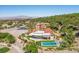 An aerial view of a stunning home with a private pool and lush landscaping at 1 Costa Del Sol Ct, Henderson, NV 89011