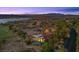 Stunning aerial view of a luxurious estate with a pool, surrounded by lush landscaping, golf course, and mountain views at 1 Costa Del Sol Ct, Henderson, NV 89011