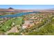 An aerial view shows a beautiful home overlooking a scenic lake and golf course at 1 Costa Del Sol Ct, Henderson, NV 89011