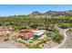 An upscale residence boasts a pool, lush landscaping, and a prime location on a scenic hillside at 1 Costa Del Sol Ct, Henderson, NV 89011