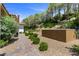 Landscaped backyard with a pathway and wall at 1 Costa Del Sol Ct, Henderson, NV 89011