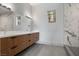 Modern bathroom with double sinks, stylish vanity, and marble-tiled shower at 1 Costa Del Sol Ct, Henderson, NV 89011