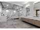 A sleek bathroom offers a glass enclosed shower and dual vanity sinks at 1 Costa Del Sol Ct, Henderson, NV 89011
