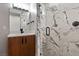 Luxurious bathroom featuring a marble walk-in shower with sleek hardware and modern vanity at 1 Costa Del Sol Ct, Henderson, NV 89011